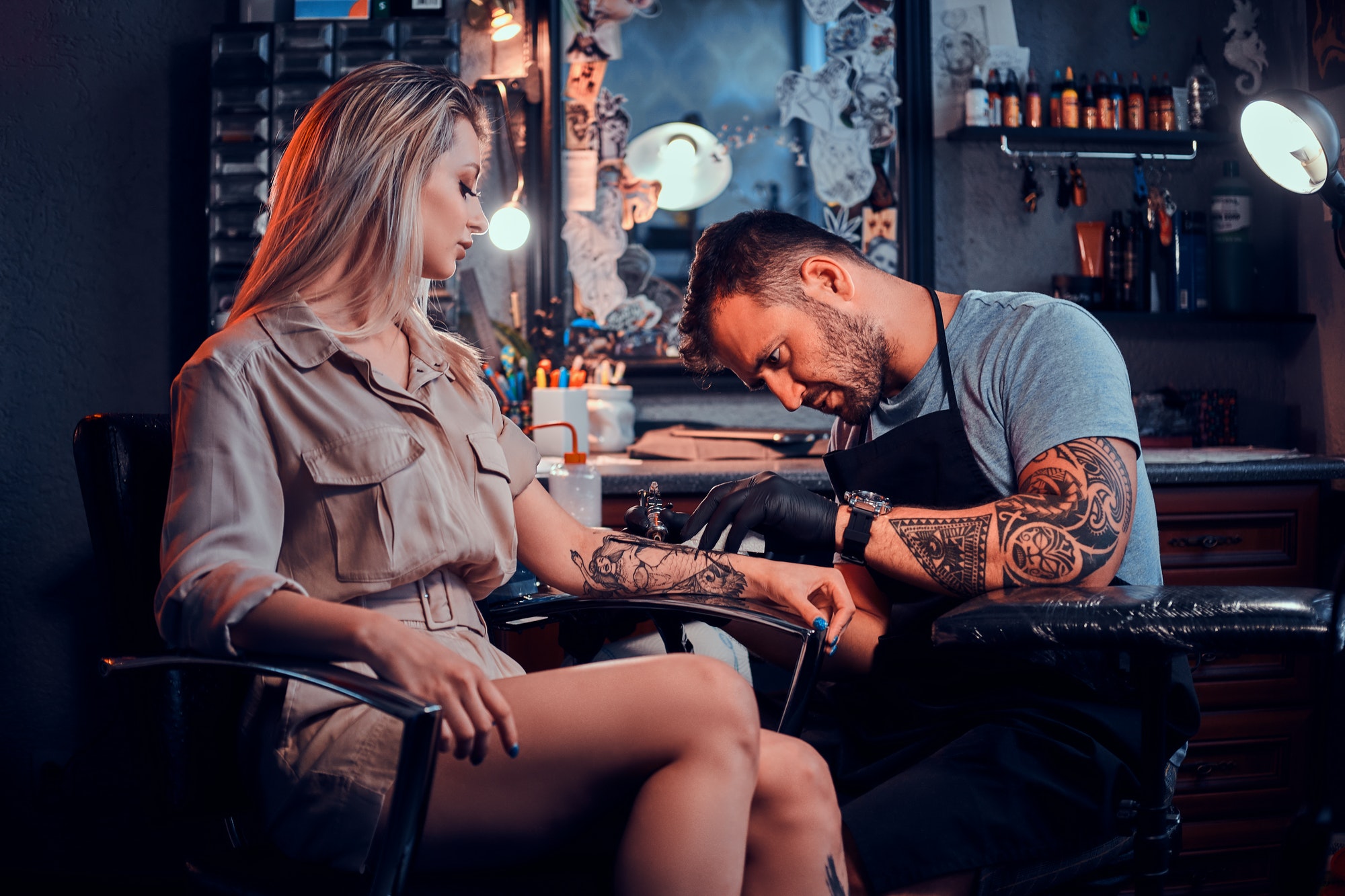 tattoo-master-is-creating-new-tattoo-for-customer.jpg